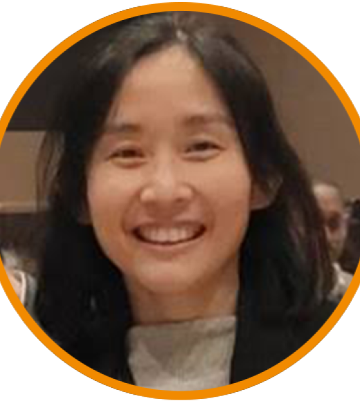 Smiling Asian woman with dark hair in circular photo frame with orange border